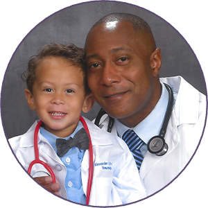 Doctor and his child dressed in white coats